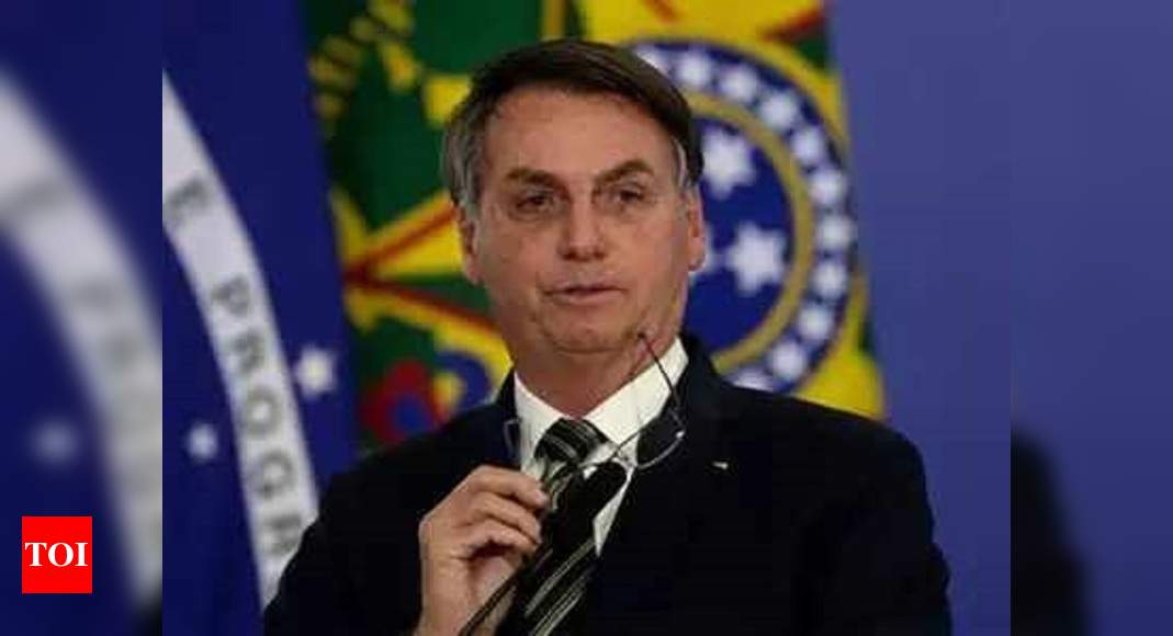 Brazil's Bolsonaro warns virus vaccine can turn people into 'crocodiles' - Times of India