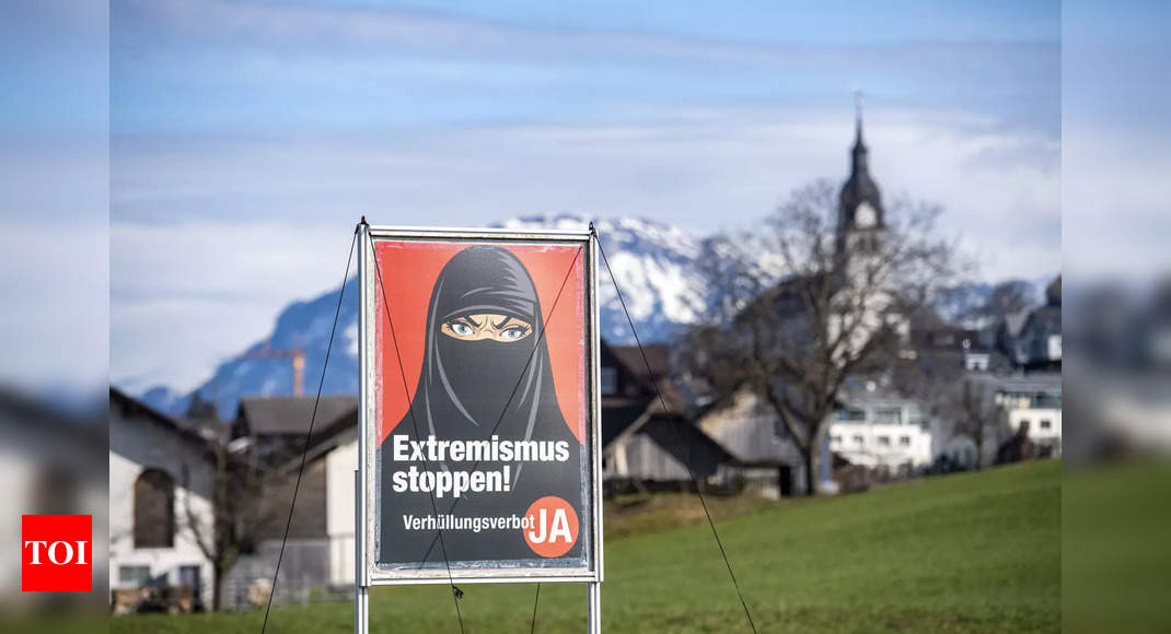 Switzerland votes to ban 'burqa' in public - Times of India