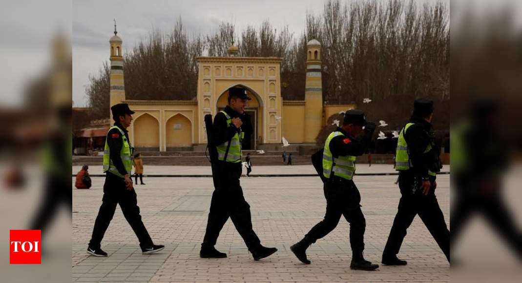 China’s Uyghur Muslims living in a ‘dystopian hellscape’: Report - Times of India