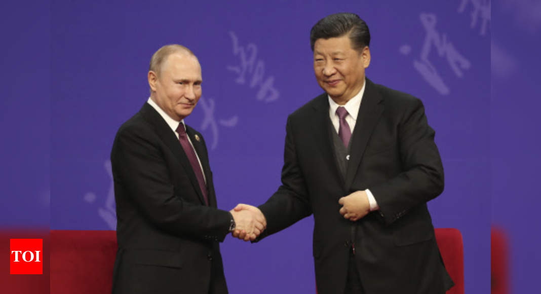 Xi, Putin extend 20-year-old friendship treaty to firm up close ties amid US, EU offensive - Times of India