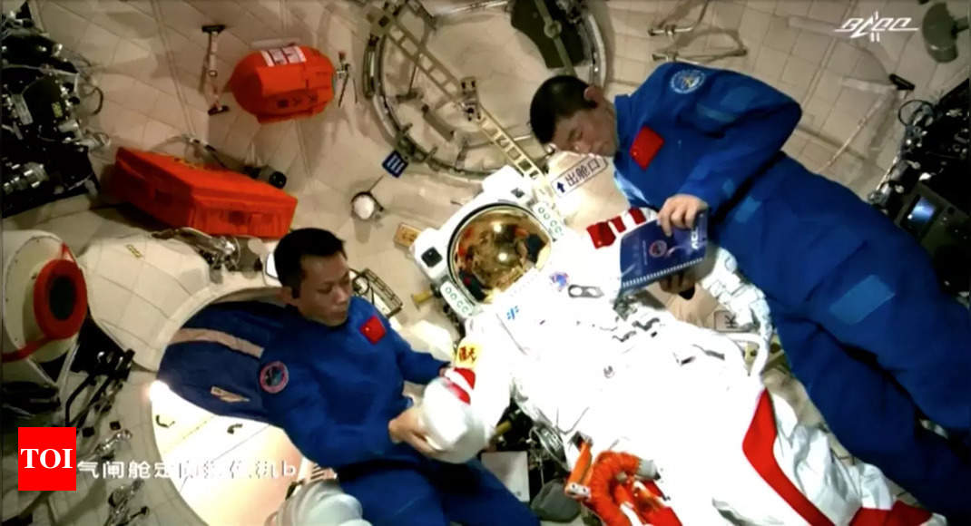 Chinese astronauts make first space walk outside new station - Times of India