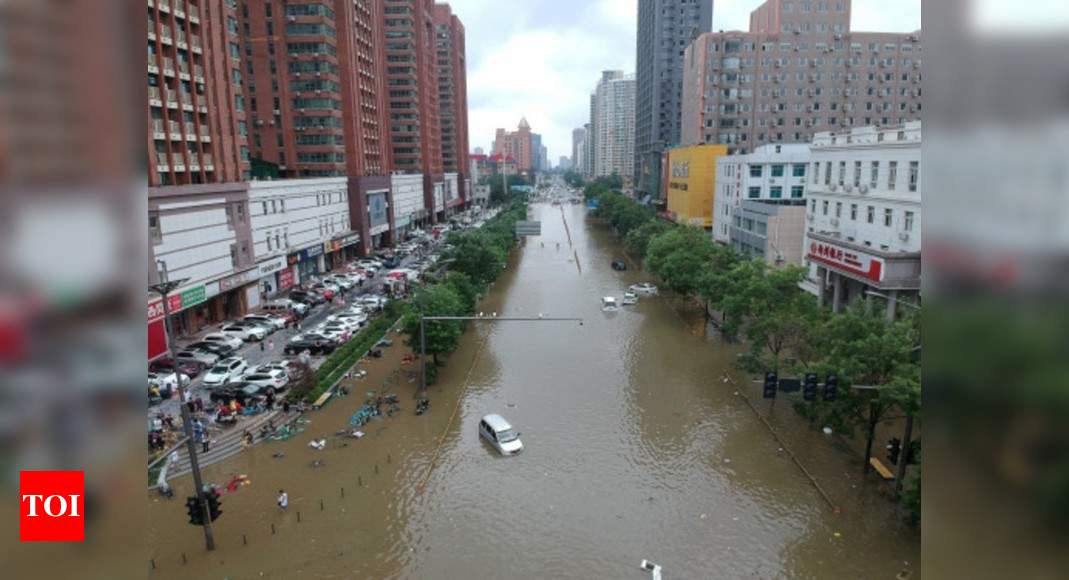 Death toll in central China floods rises to 56, losses mount to $10 billion - Times of India