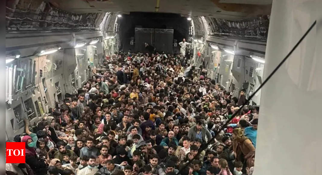 Afghanistan crisis: Striking visual shows over 600 Afghans packed inside US military plane to flee Taliban takeover - Times of India