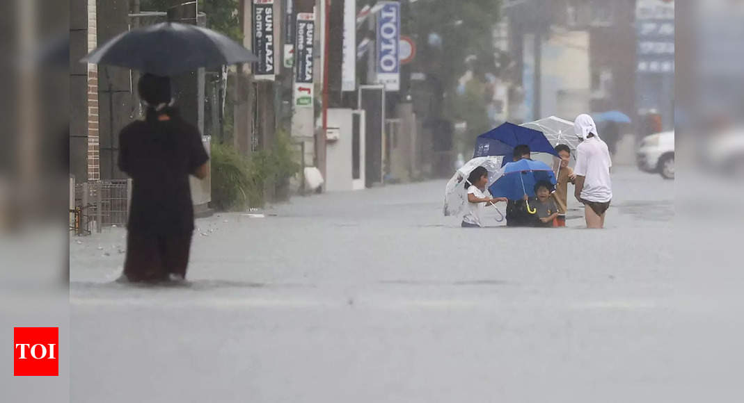 Heavy rain triggers floods, landslides in Japan - Times of India