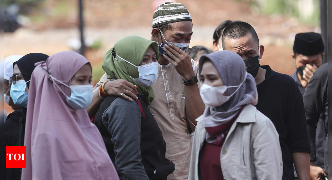 Virus-wracked Indonesia hits 100,000 deaths - Times of India